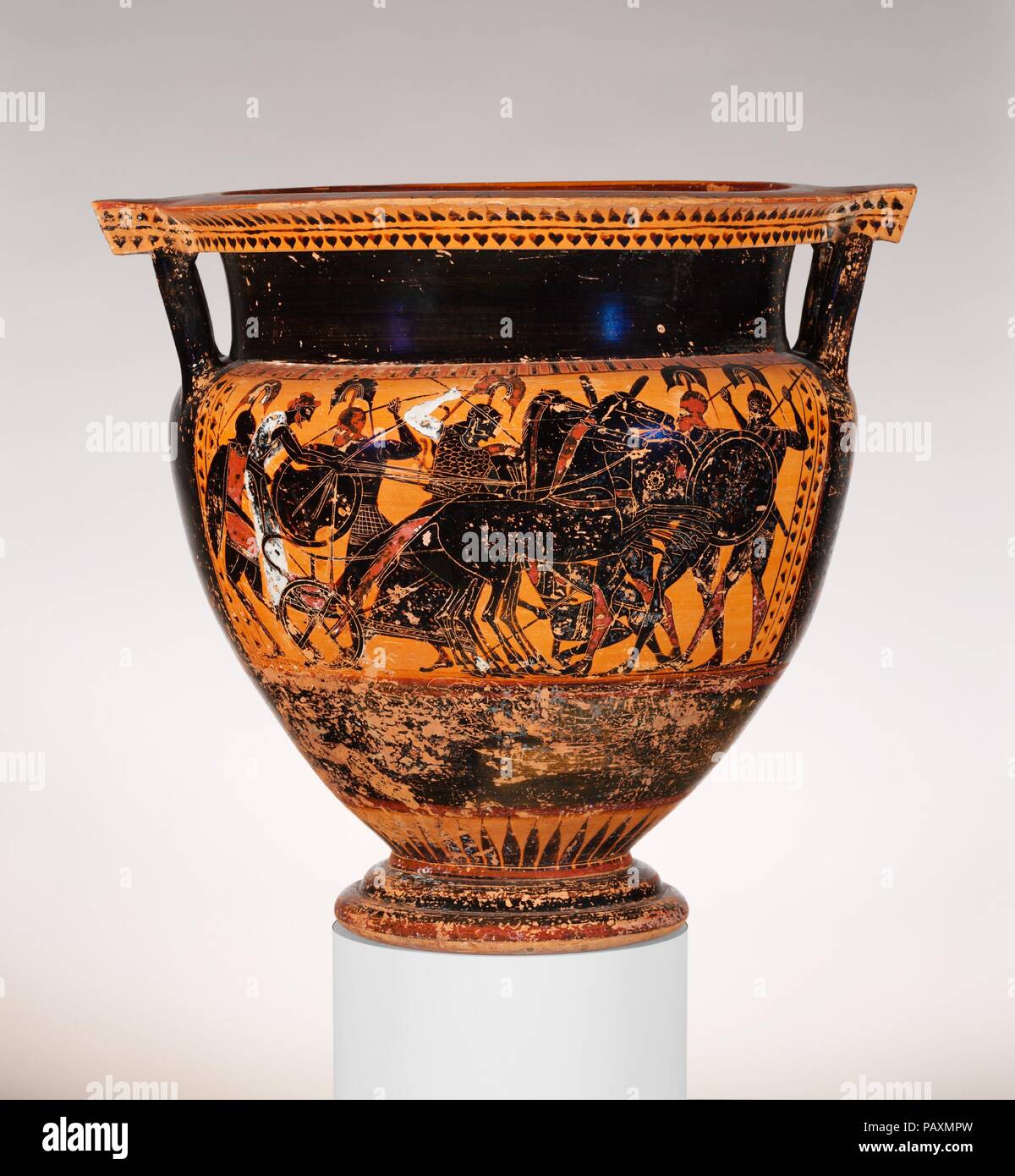 Terracotta column-krater (bowl for mixing wine and water). Culture: Greek, Attic. Dimensions: H. 19 7/8 in. (50.5 cm)  diameter of mouth  18 3/4 in. (47.6 cm). Date: ca. 540 B.C..  Obverse, Gigantomachy (battle of gods and giants)  Reverse, Dionysos with satyrs and maenads  During the latter part of the sixth century B.C., black-figure artists mastered their medium sufficiently to create compositions with many figures in action and in complex spatial relationships. Battle scenes were ideal subjects. The presence of Athena identifies the combatants here. The arms and armor are those that contem Stock Photo