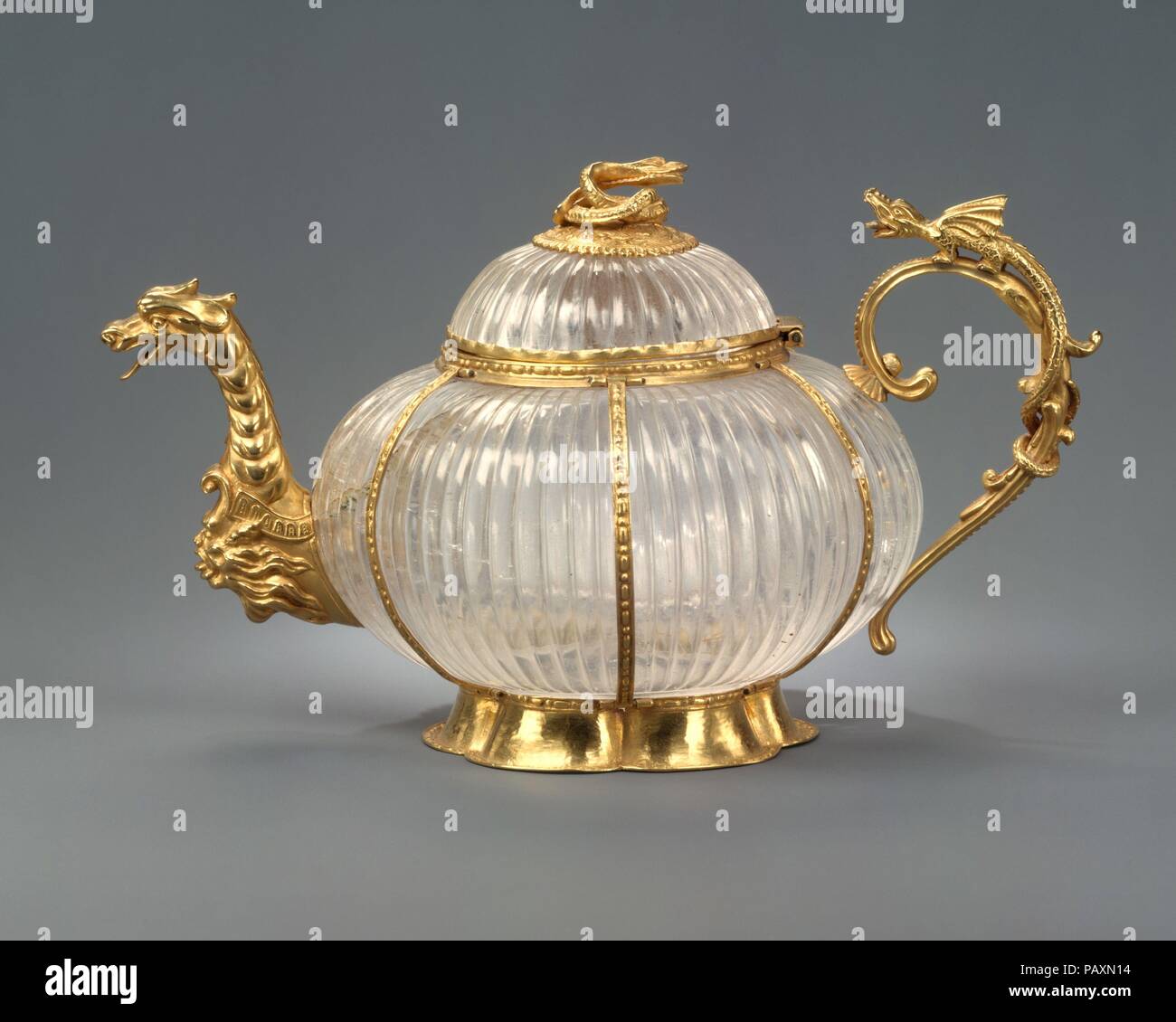 Teapot. Culture: German, Dresden mounts and Indian, Mughal crystal. Dimensions: Overall: 3 5/8 × 6 1/16 in. (9.2 × 15.4 cm). Date: rock crystal ca. 1700, mounts ca. 1720.  From the turn of the seventeenth century until about 1725, the Saxon court at Dresden flourished as a center for the production of fanciful decorative object sin which goldsmiths' work was combined with such varied and exotic materials as jade, rhinoceros horn, and emeralds. Each of these materials--like the ostrich eggs, coral, and coconut shells popular in the previous century-- symbolized contact with a remote part of the Stock Photo