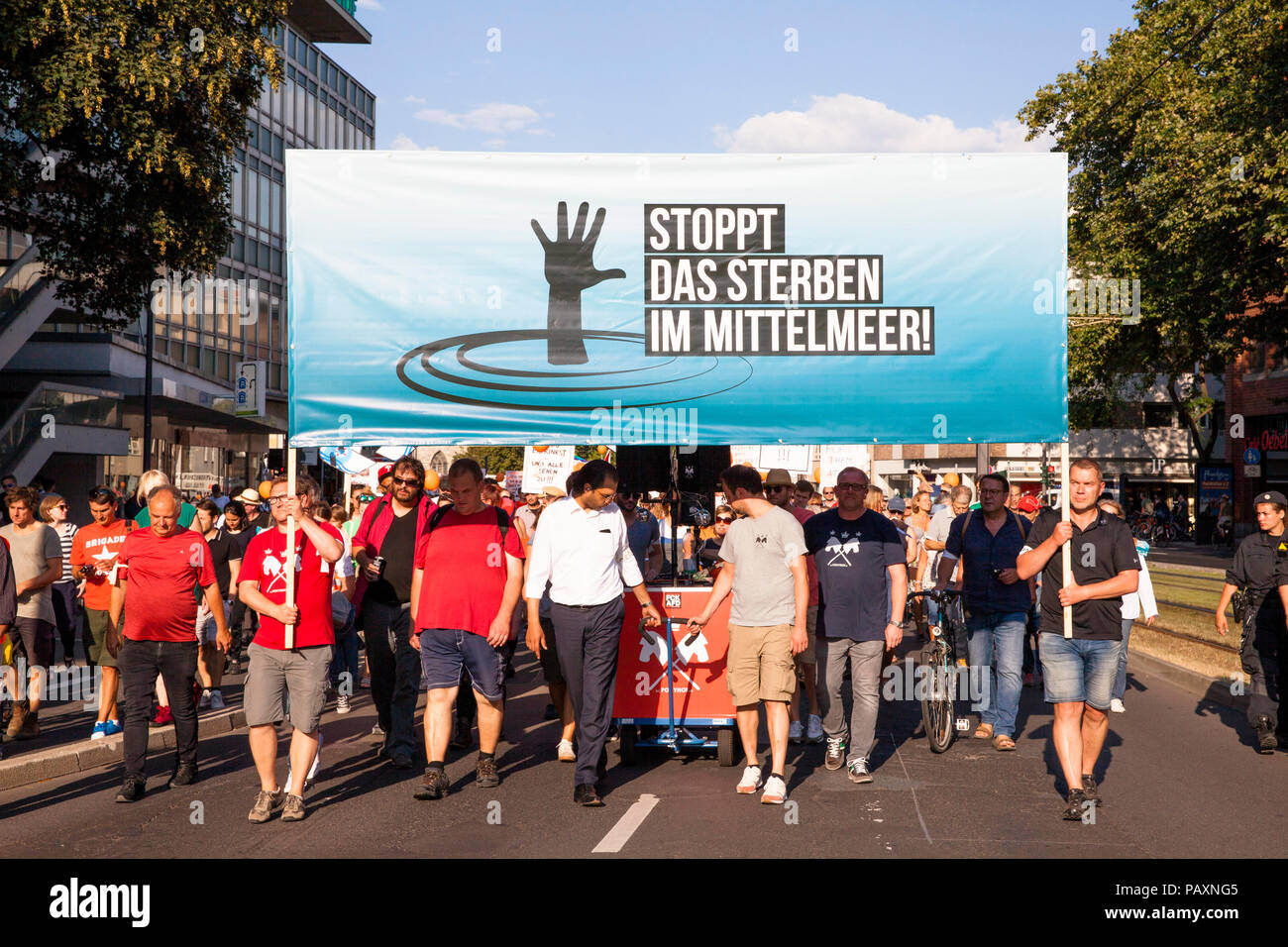 Several thousand people demonstrate on July 13, 2018 in Cologne for the rescue of refugees from the Mediterranean Sea. Under the motto 'Stop dying in  Stock Photo