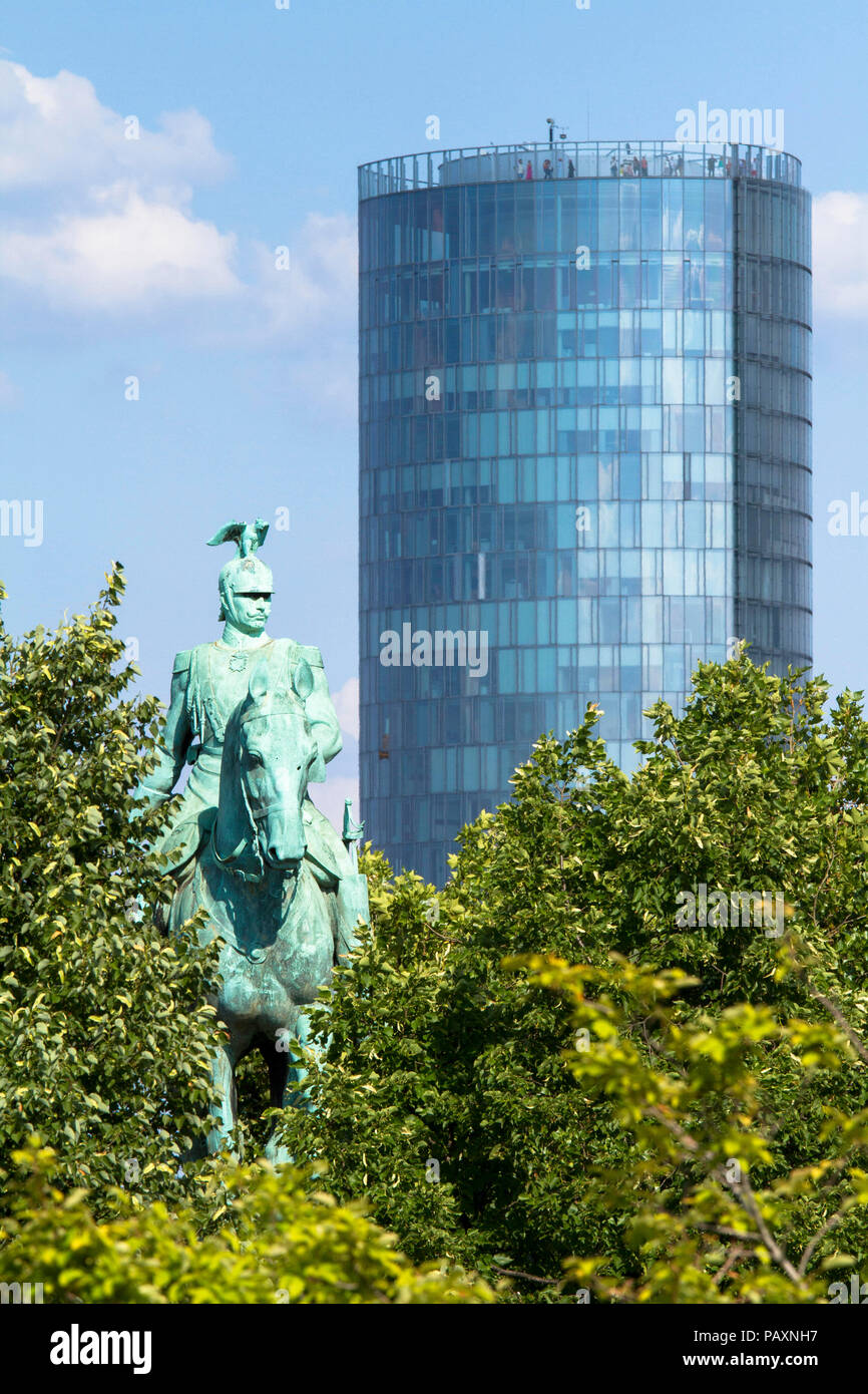 Germany, Cologne, equestrian statue at the Hohenzollern bridge and the Cologne Triangle skyscraper in the town district Deutz.  Deutschland, Koeln, Re Stock Photo