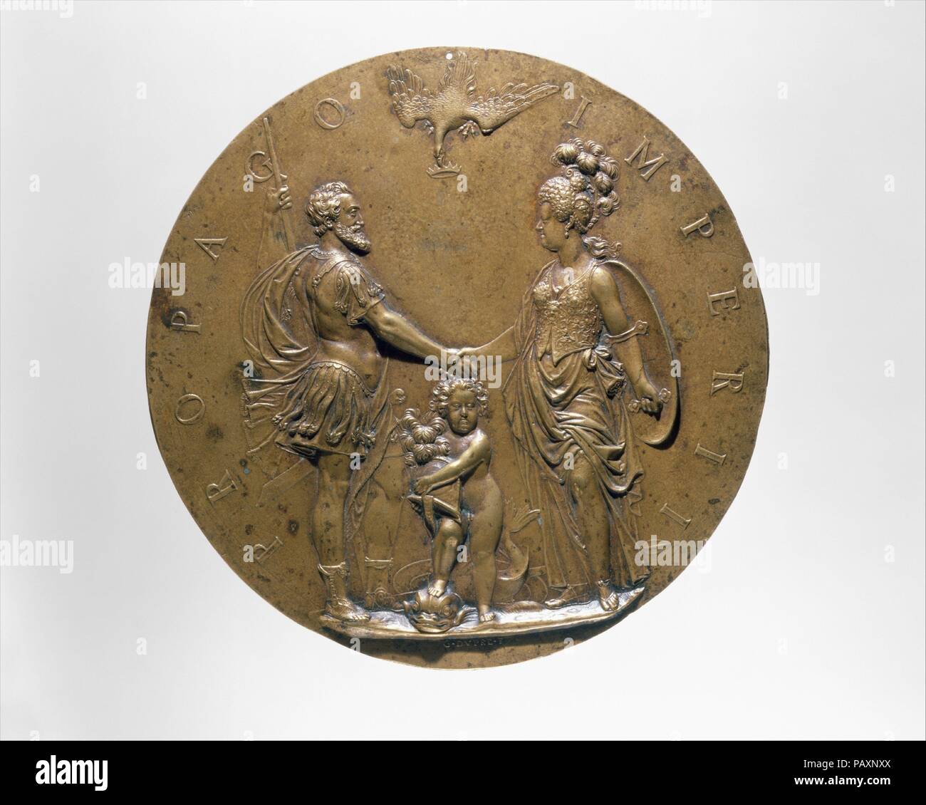 Henri IV, Marie de Médicis and the Dauphin. Artist: Guillaume Dupré (French, 1579-1640). Culture: French, Paris. Dimensions: Diameter: 7 1/2 in. (19.1 cm). Date: 1605.  The composition represents a rethinking and clarification of a smaller medal that Dupré produced in 1603 to celebrate Henri IV's heir. The dauphin, the future Louis XIII, stands between his parents, who are garbed as Mars and Minerva. With one foot planted on the head of a dolphin, his usual attribute, the dauphin bears his father's helmet. Henri IV was already greatly taken with the earlier medal and issued letters patent auth Stock Photo