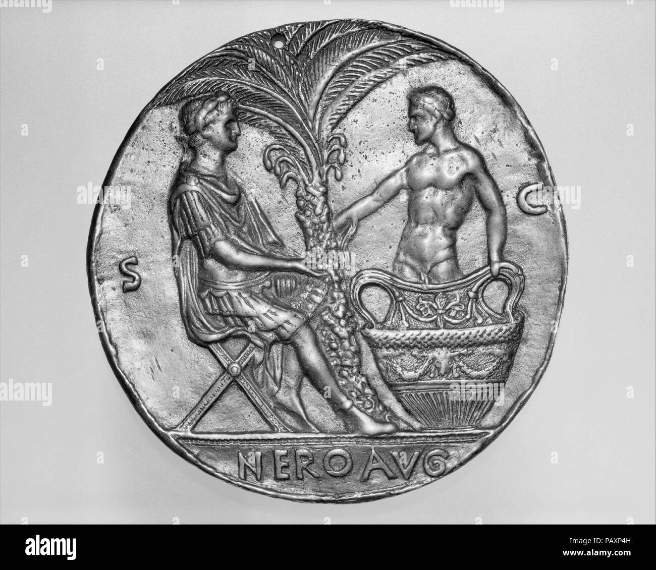 Nero and the Dying Seneca. Artist: After a design by Master of the Roman Emperors (active mid-15th century). Culture: possibly Italian, Rome. Dimensions: Diameter: 4 1/8 in. (105 mm). Date: ca. 1445.  This is a uniface cast of the reverse of a medal of Nero, the obverse of which shows his bust to the right. It is the work of an unidentified medallist, active in the 15th century, who specialized in pastiches of ancient Roman coins enlarged in scale. He habitually included the initials S[enatus] C[onsulto] ('by order of the Senate') which he had observed on such coins. Museum: Metropolitan Museu Stock Photo