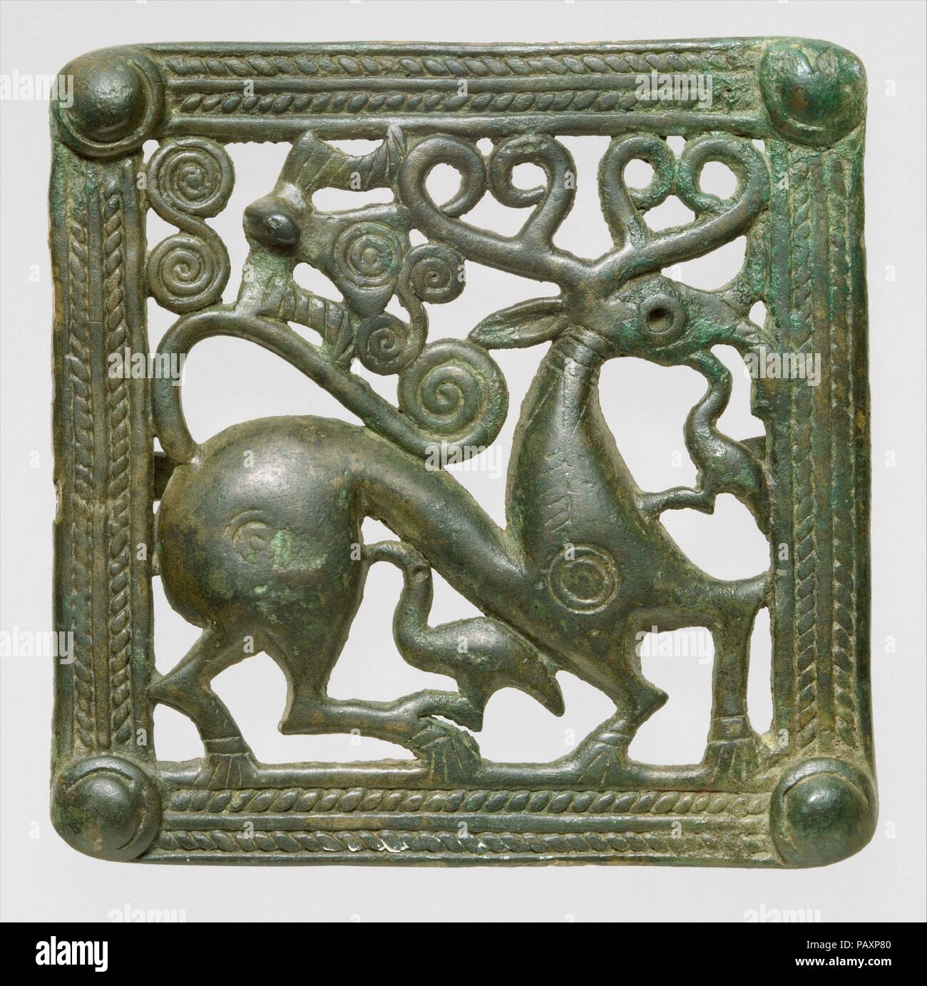 Belt clasp. Dimensions: H. 11.4 cm, W. 11.4 cm. Date: ca. A.D. 1st-2nd century.  In the late second millennium B.C., the tradition of lively animal-ornamented bronzes begins in the Caucasus region. Stylized animals with small waists, arched necks and backs are seen on numerous bronze tools including axes and pins, and are found in Georgia, Armenia, Azerbaijan, and the Northern Caucasus by the beginning of the Late Bronze and Early Iron ages.  Cast-bronze belt clasps similar to this one have been excavated in the Republic of Georgia and are a distinctive product of that region in the first few  Stock Photo