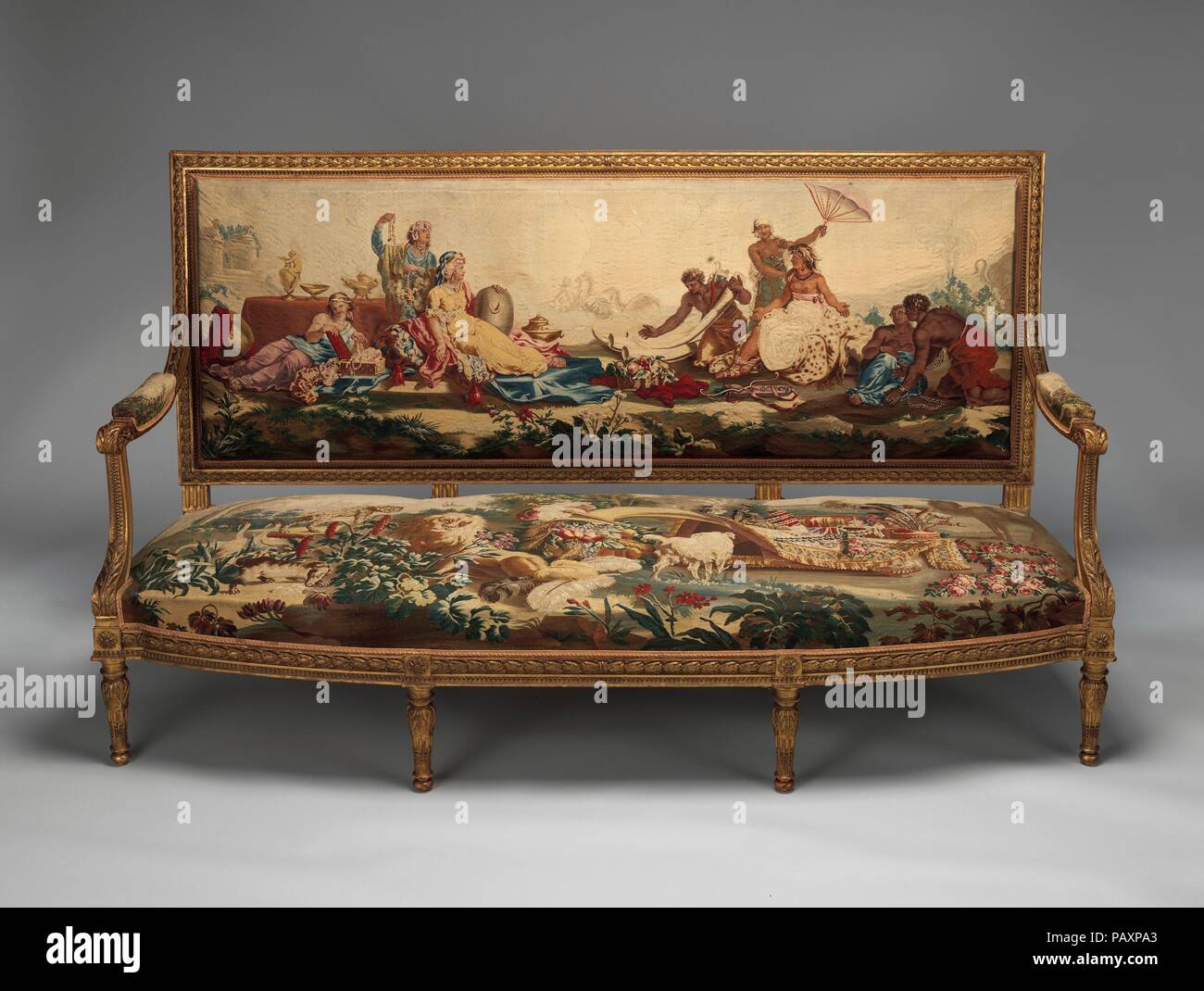 Settee. Artist: After a composition by Jean Jacques François Le Barbier (French, Rouen 1738-1826 Paris). Culture: French, Beauvais. Dimensions: Overall: 42 1/4 × 75 3/8 × 28 in. (107.3 × 191.5 × 71.1 cm). Factory: Tapestry upholstery by Beauvais. Maker: Workshop of de Menou (French, active 1780-93). Patron: Commissioned for Louis XVI, King of France (French, Versailles 1754-1793 Paris). Date: designed ca. 1786, woven 1790-91; settee frame second half 19th century.  Louis XVI commissioned the tapestry-woven upholstery for two settees (1978.5a-c, .6a-c) and twelve armchairs (1978.404.7a-c-.18a-c Stock Photo