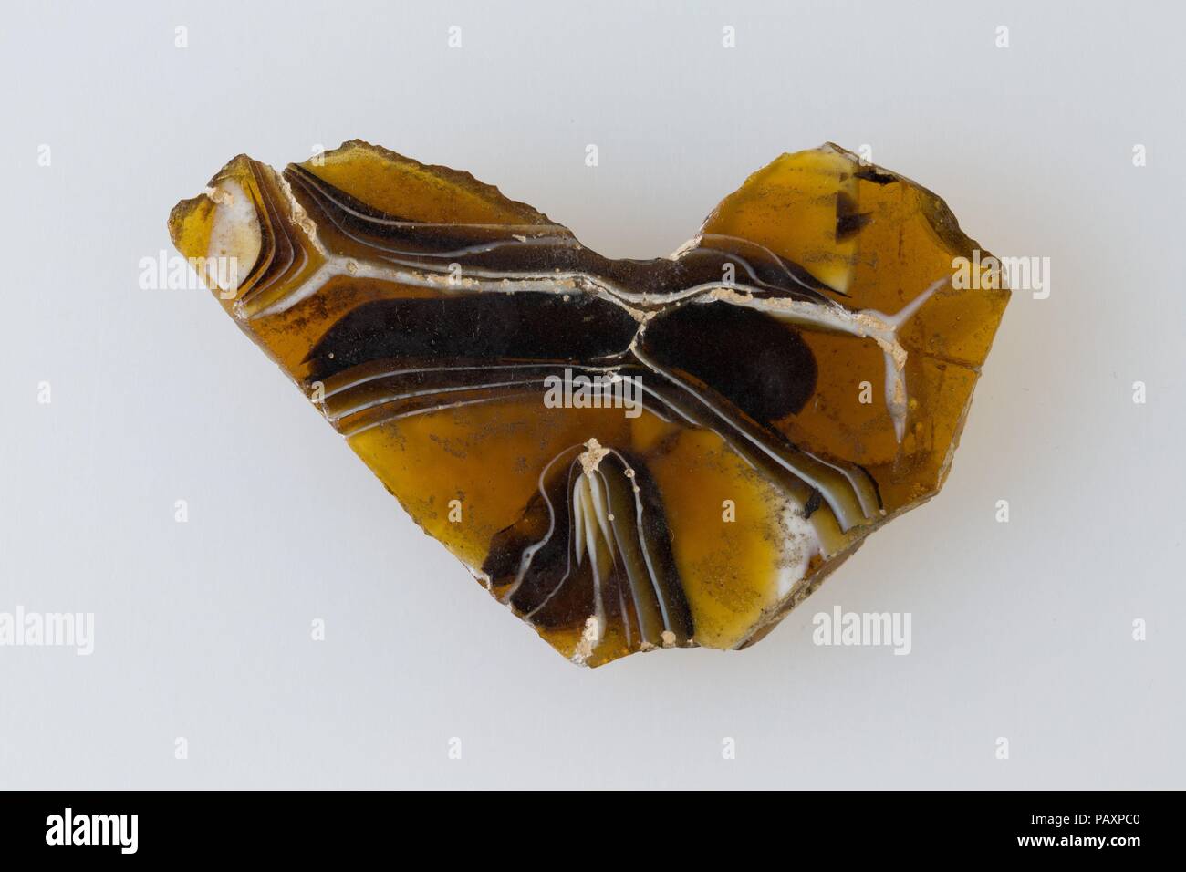 Wall revetment, agate pattern. Dimensions: H. 3 × W. 4.9 cm (1 3/16 × 1 15/16 in.). Date: 200 BC-100 AD.  Glass plaques imitating expensive marble or stones were used as wall coverings. Museum: Metropolitan Museum of Art, New York, USA. Stock Photo