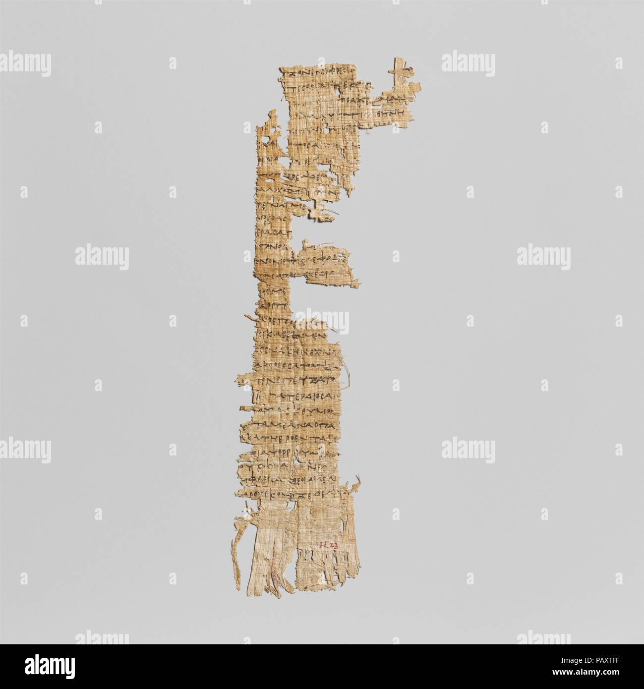 Papyrus fragment with lines from Homer's Odyssey. Culture: Greek, Ptolemaic. Dimensions: 7 1/2 in. (19.1 cm). Date: ca. 285-250 B.C..  For the ancient Greeks, papyrus, a paper made from the stalks of the papyrus plant, was the preferred material on which to record permanent writings, such as a marriage contract or, as here, a book. Writing on papyrus was done with a stylus, such as a sharpened reed with a split point or a bronze pen with nib, and ink, usually made of lampblack in water.   This is the first early Ptolemaic fragment of the Odyssey ever discovered. It contains three lines from Bo Stock Photo