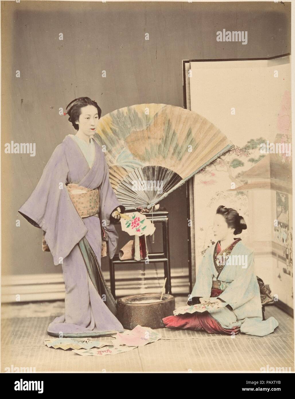[Two Japanese Women in Traditional Dress with Fan and Screen]. Artist: Suzuki Shin'ichi (Japanese, 1835-1919). Dimensions: 25.2 x 19.7 cm (9 15/16 x 7 3/4 in.). Date: 1870s. Museum: Metropolitan Museum of Art, New York, USA. Stock Photo