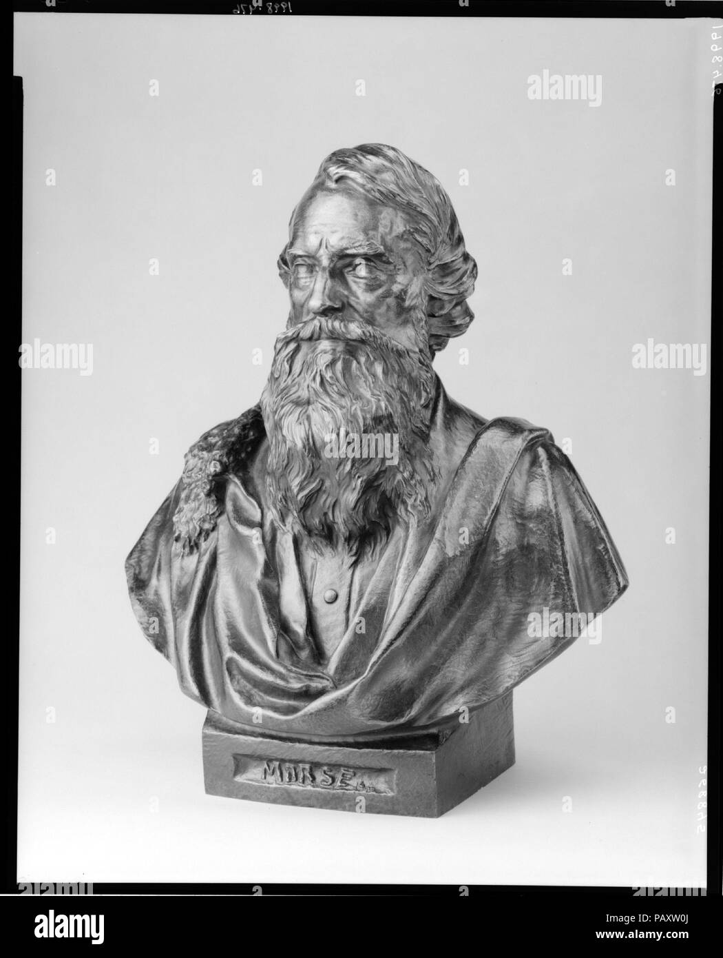 Samuel F. B. Morse. Artist: Byron M. Pickett (ca. 1834-1907). Dimensions: 15 1/2 x 12 3/4 x 9 3/8 in. (39.4 x 32.4 x 23.8 cm). Date: ca. 1870.  Pickett's bust-length portrait of Morse is related to his over-lifesize bronze statue of the artist-inventor, dedicated in 1871 in Central Park. The elderly bearded Morse is portrayed in contemporary dress with cloaked shoulders. His drape and unincised pupils are typical neoclassical portrait devices that persisted well into the nineteenth century. This blend of realism and classicism exemplifies the portrait style favored by such other New York-based Stock Photo