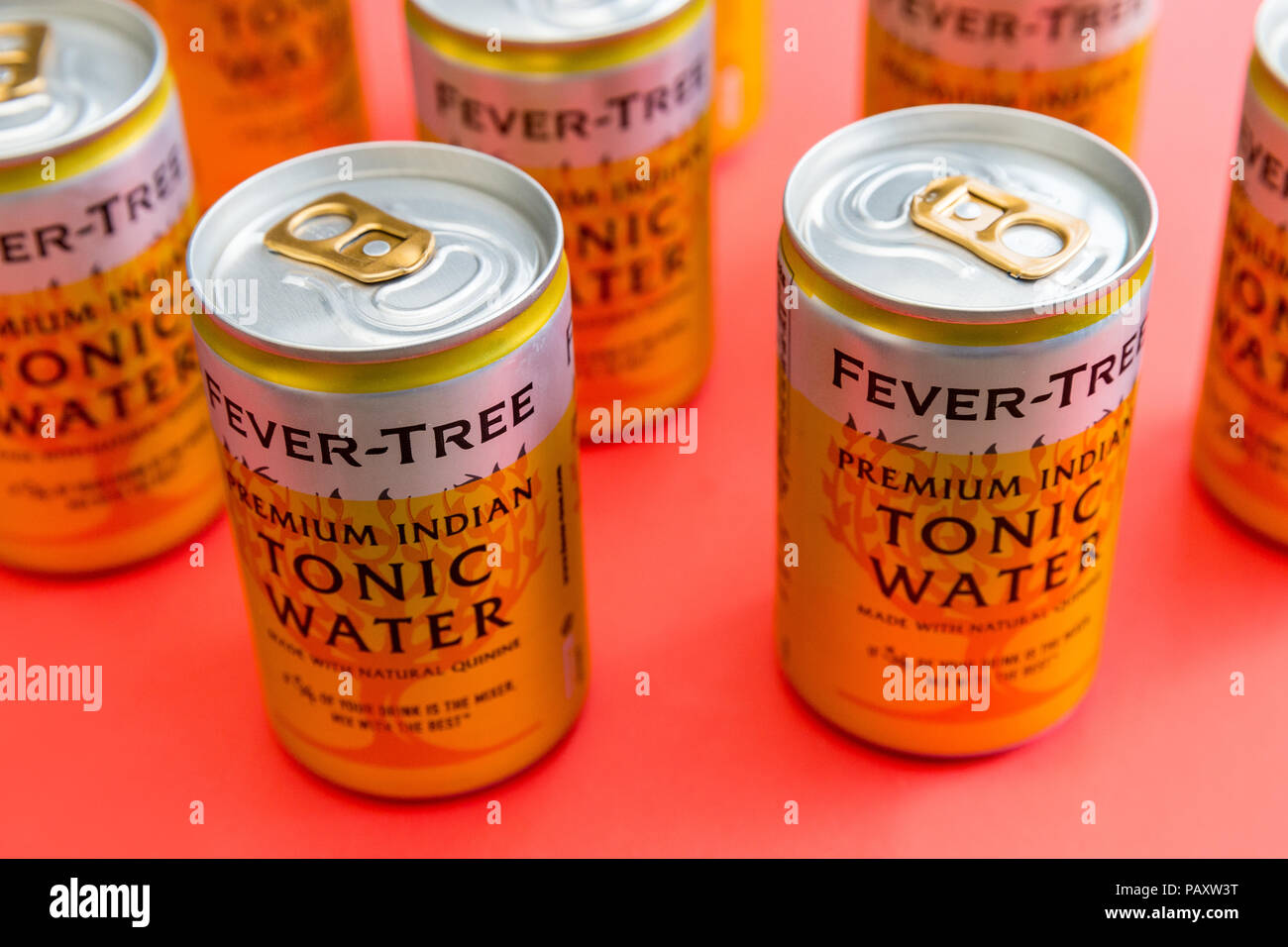 LONDON - July 18, 2018: Fever Tree tonic water cans on red background Stock Photo