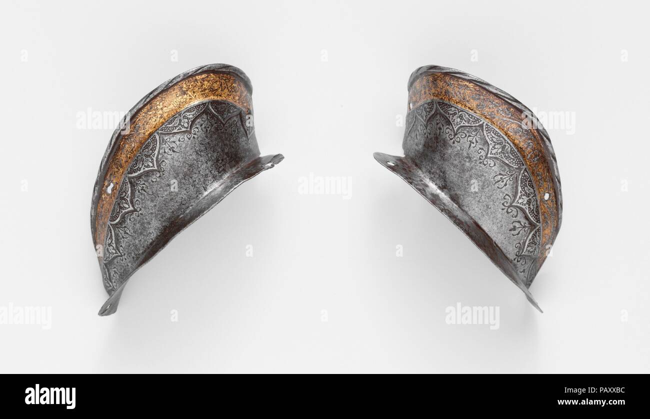 Two Ear Guards from a Shaffron (Horse's Head Defense) of Emperor Charles V (1500-1558). Armorer: Attributed to Desiderius Helmschmid (German, Augsburg, 1513-1579). Culture: German, Augsburg. Dimensions: 20.151.7; H. 5 3/8 in. (13.7 cm); W. 2 3/4 in. (7 cm), Wt. 2 oz. (47 g); 20.151.8; H. 5 1/4 in. (13.3 cm); W. 2 7/8 in. (7.3 cm), Wt. 2 oz. (51 g). Date: 1544.  These detached ear guards belong to a shaffron from the most famous of Charles V's (1500-1558) armors, the so-called Mühlberg garniture (after the Battle of Mühlberg--April 24, 1547--at which the emperor wore parts of that armor). Dated Stock Photo
