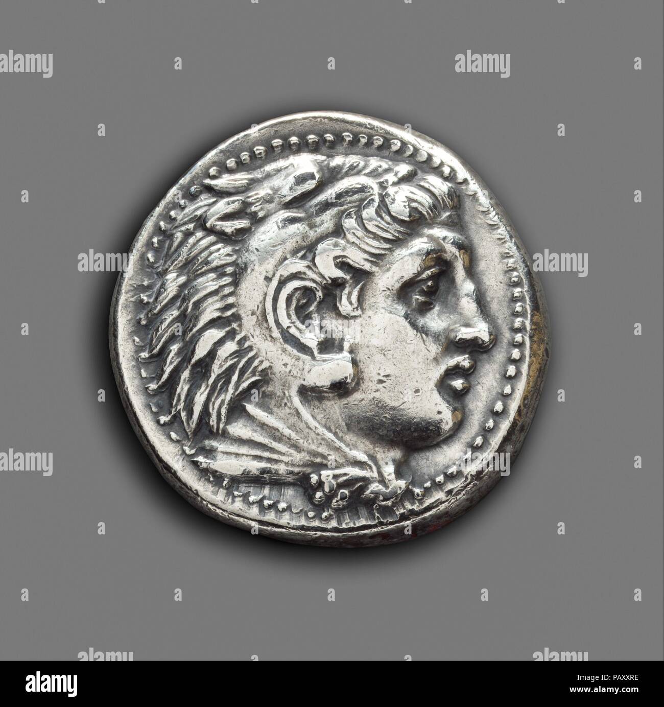 Silver tetradrachm. Culture: Greek. Dimensions: Diam.: 1 1/16 in. (2.7 cm). Date: 315-308 B.C..  Of Alexander III of Macedon, Pella: head of Herakles; seated Zeus. Museum: Metropolitan Museum of Art, New York, USA. Stock Photo