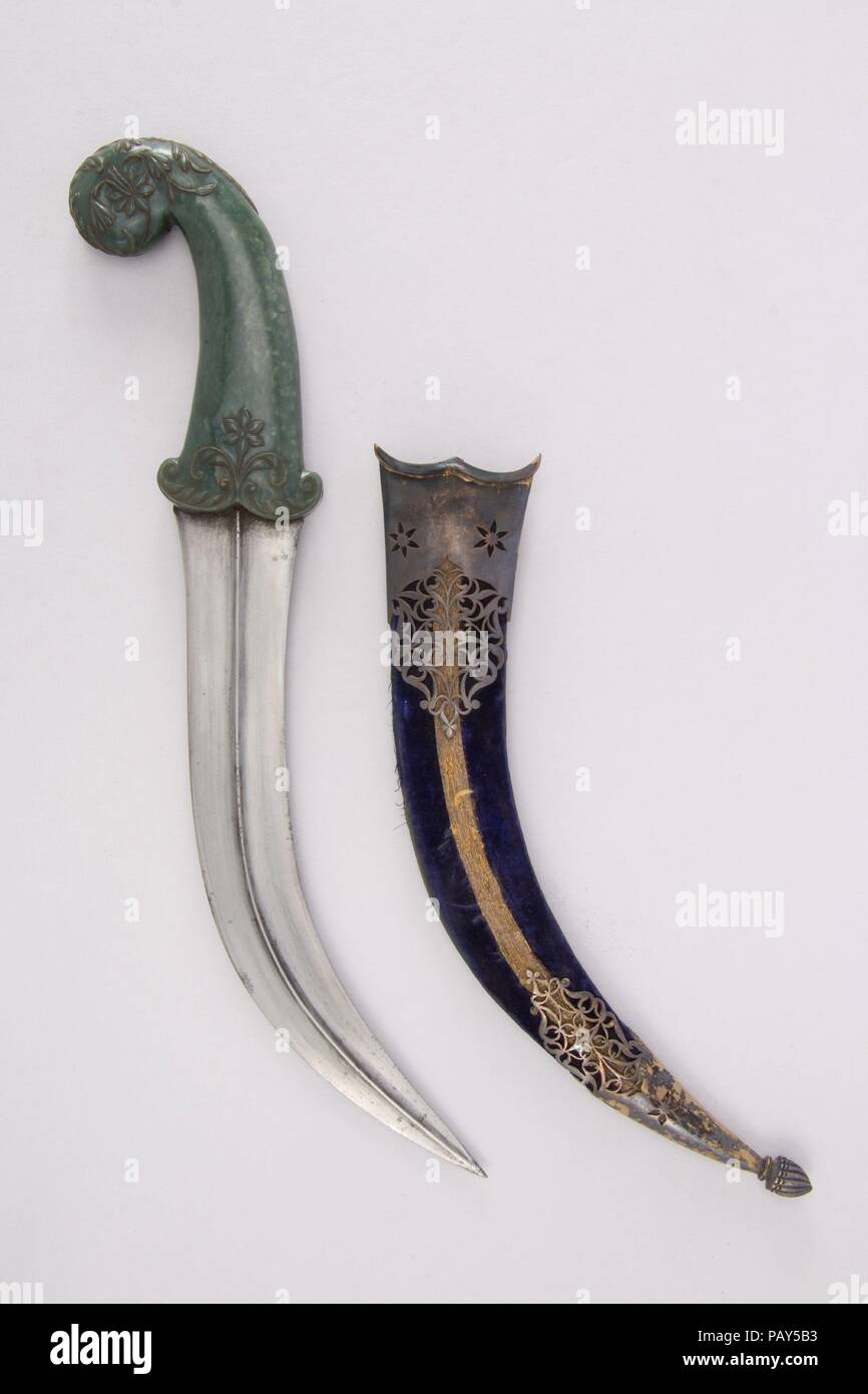 Dagger (Jambiya) with Sheath and Carrier. Culture: Indian, Mughal. Dimensions: Dagger (a); H. with sheath 15 1/4 in. (38.7 cm); H. without sheath 14 1/2 in. (36.8 cm); H. of blade 10 in. (25.4 cm); W. 3 5/8 in. (9.2 cm); Wt. 14.4 oz. (408.2 g); sheath (b); Wt. 5.1 oz. (144.6 g); carrier (c); L. 7 1/2 in. (19.1 cm); Wt. 2.6 oz. (73.7 g). Date: 18th century. Museum: Metropolitan Museum of Art, New York, USA. Stock Photo