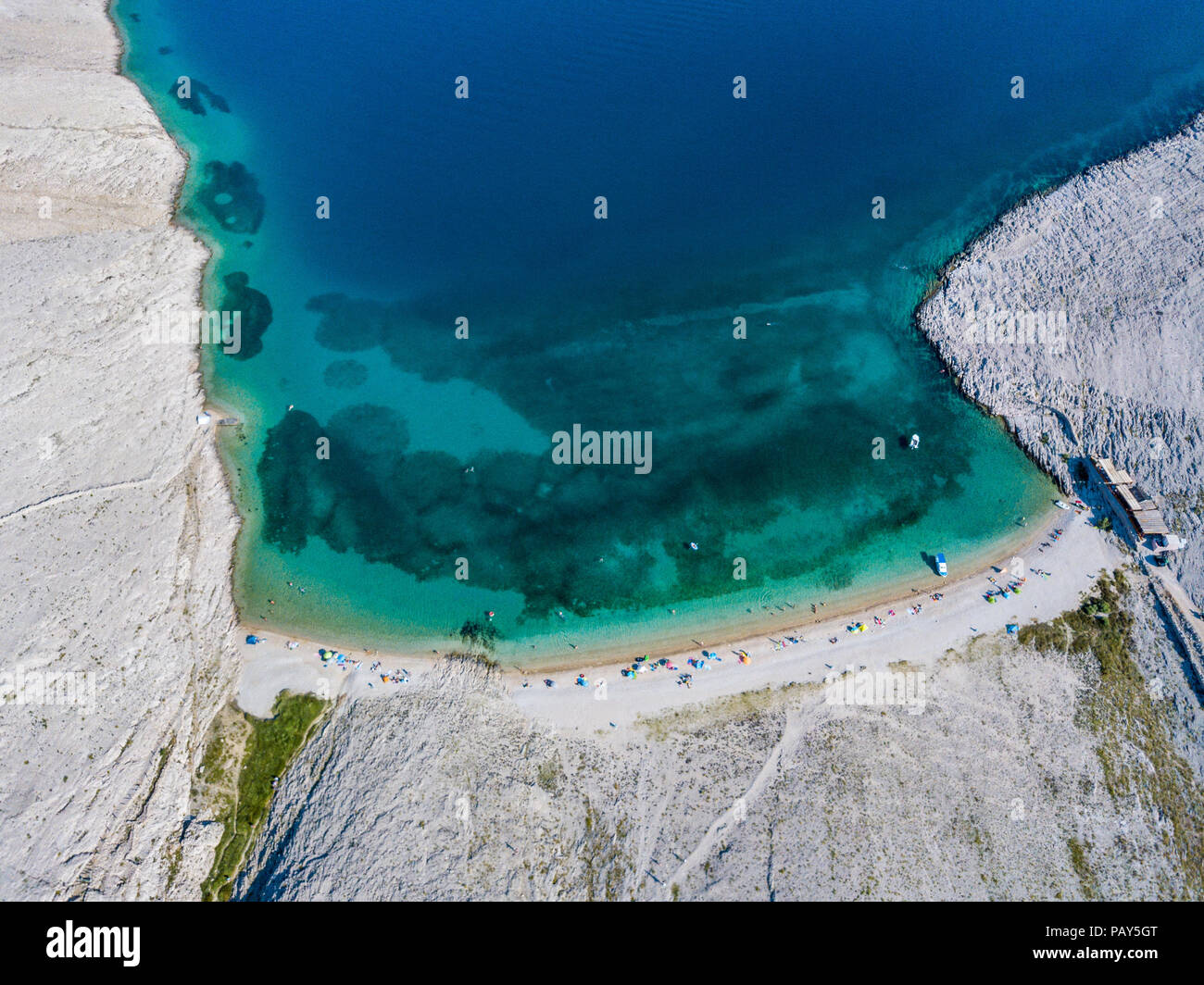 Aerial view of Rucica beach on Pag island, Metajna, Croatia. Seabed and beach seen from above. Promontories and cliffs of Croatian coasts. Holiday Stock Photo