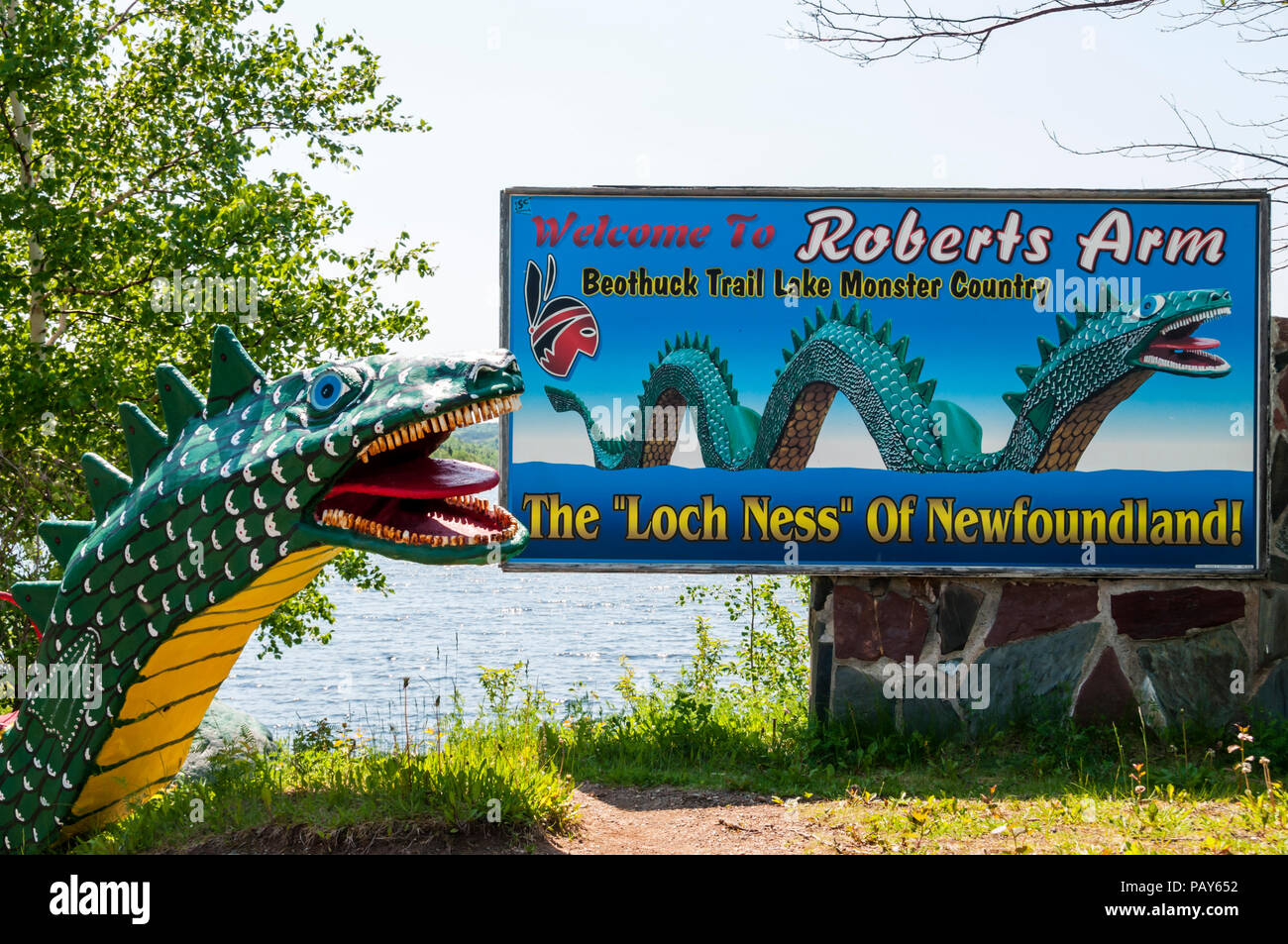 A sign at Roberts Arm on Crescent Lake, Newfoundland, has a picture and model of Cressie the legendary monster said to inhabit the lake. Stock Photo