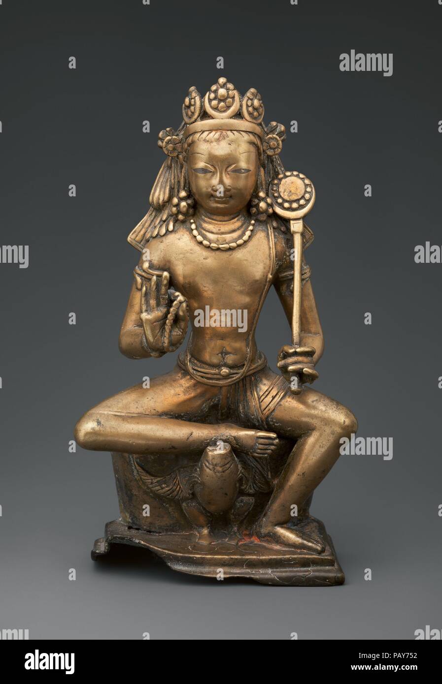 Karttikeya, the God of War. Culture: India (Jammu and Kashmir, ancient kingdom of Kashmir). Dimensions: H. 10 1/2 × W. 6 1/4 × D. 3 in. (26.7 × 15.9 × 7.6 cm). Date: 8th century.  Here, the god of war sits regally on his vehicle, a peacock, as if enthroned. He displays the rosary (aksamala) favored by his father, Shiva, and, instead of his usual javelin, holds a disk standard seemingly with solar symbolism. This iconography is unprecedented. Museum: Metropolitan Museum of Art, New York, USA. Stock Photo