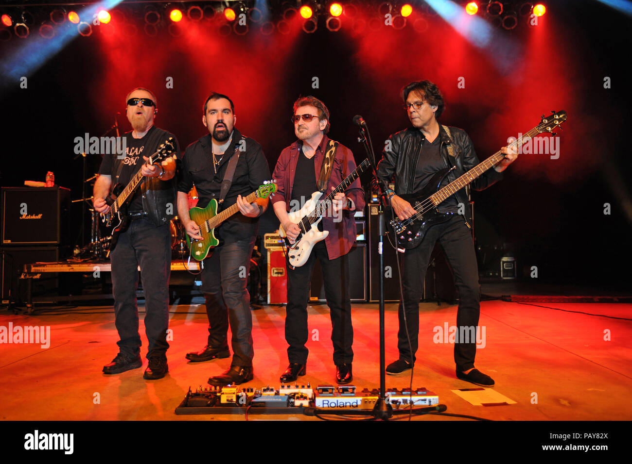 POMPANO BEACH, FL - AUGUST 15: Eric Bloom, Jules Radino and Donald 'Buck Dharma' Roeser of Blue Oyster Cult perform at the Pompano Beach Ampitheatre on August 15, 2015 in Pompano Beach Florida.   People:  Eric Bloom, Richie Castellano, Donald Roeser, Kasim Sulton Stock Photo