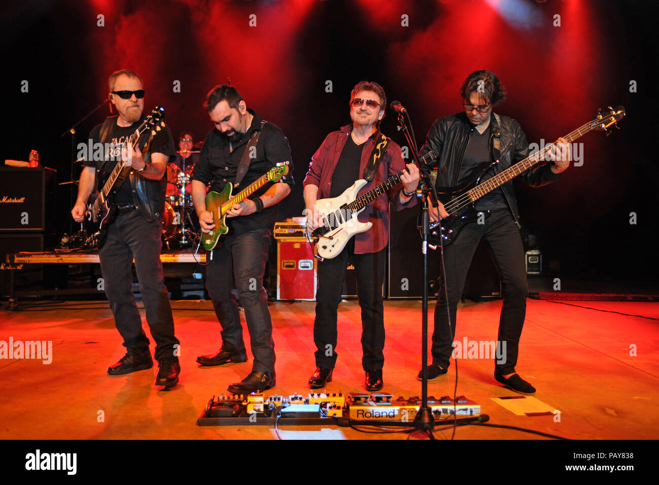 POMPANO BEACH, FL - AUGUST 15: Eric Bloom, Jules Radino and Donald 'Buck Dharma' Roeser of Blue Oyster Cult perform at the Pompano Beach Ampitheatre on August 15, 2015 in Pompano Beach Florida.   People:  Eric Bloom, Richie Castellano, Donald Roeser, Kasim Sulton Stock Photo