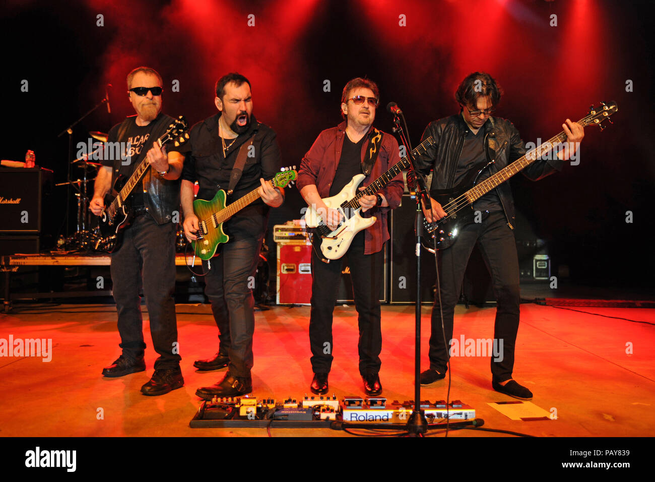 POMPANO BEACH, FL - AUGUST 15: Eric Bloom, Jules Radino and Donald 'Buck Dharma' Roeser of Blue Oyster Cult perform at the Pompano Beach Ampitheatre on August 15, 2015 in Pompano Beach Florida.   People:  Eric Bloom, Richie Castellano, Donald Roeser, Kasim Sulton Stock Photo