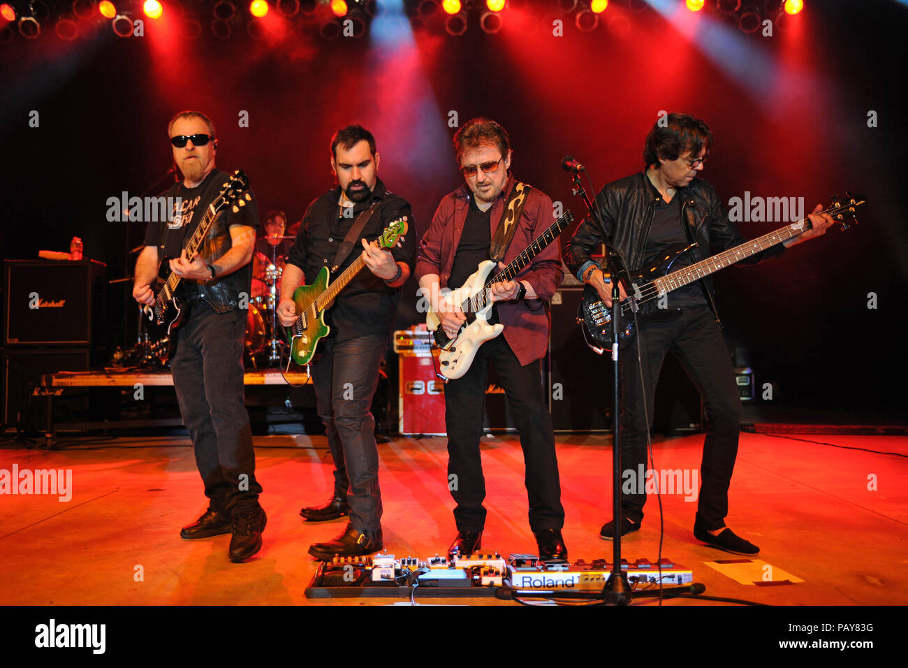 POMPANO BEACH, FL - AUGUST 15: Eric Bloom, Jules Radino and Donald 'Buck Dharma' Roeser of Blue Oyster Cult perform at the Pompano Beach Ampitheatre on August 15, 2015 in Pompano Beach Florida.   People:  Eric Bloom, Richie Castellano, Donald Roeser, Kasim Sulton Stock Photo