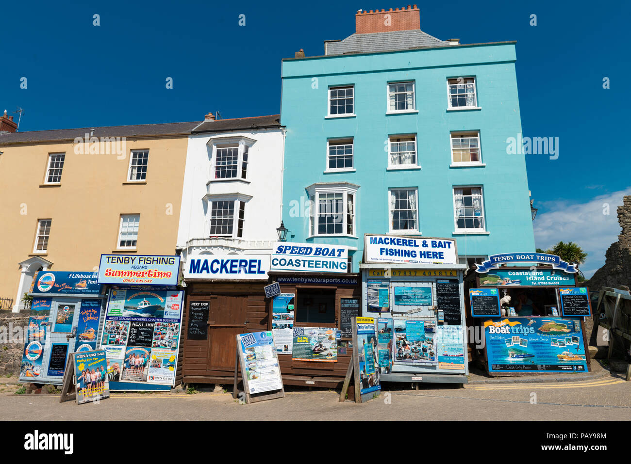 Huts selling boat trips in the pretty seaside town of Tenby, Pembrokeshire, Wales, UK. Stock Photo