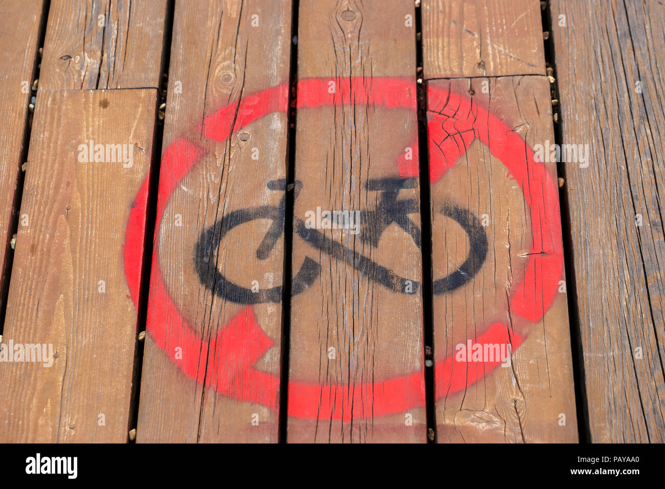 No bikes sign painted on a track Stock Photo - Alamy