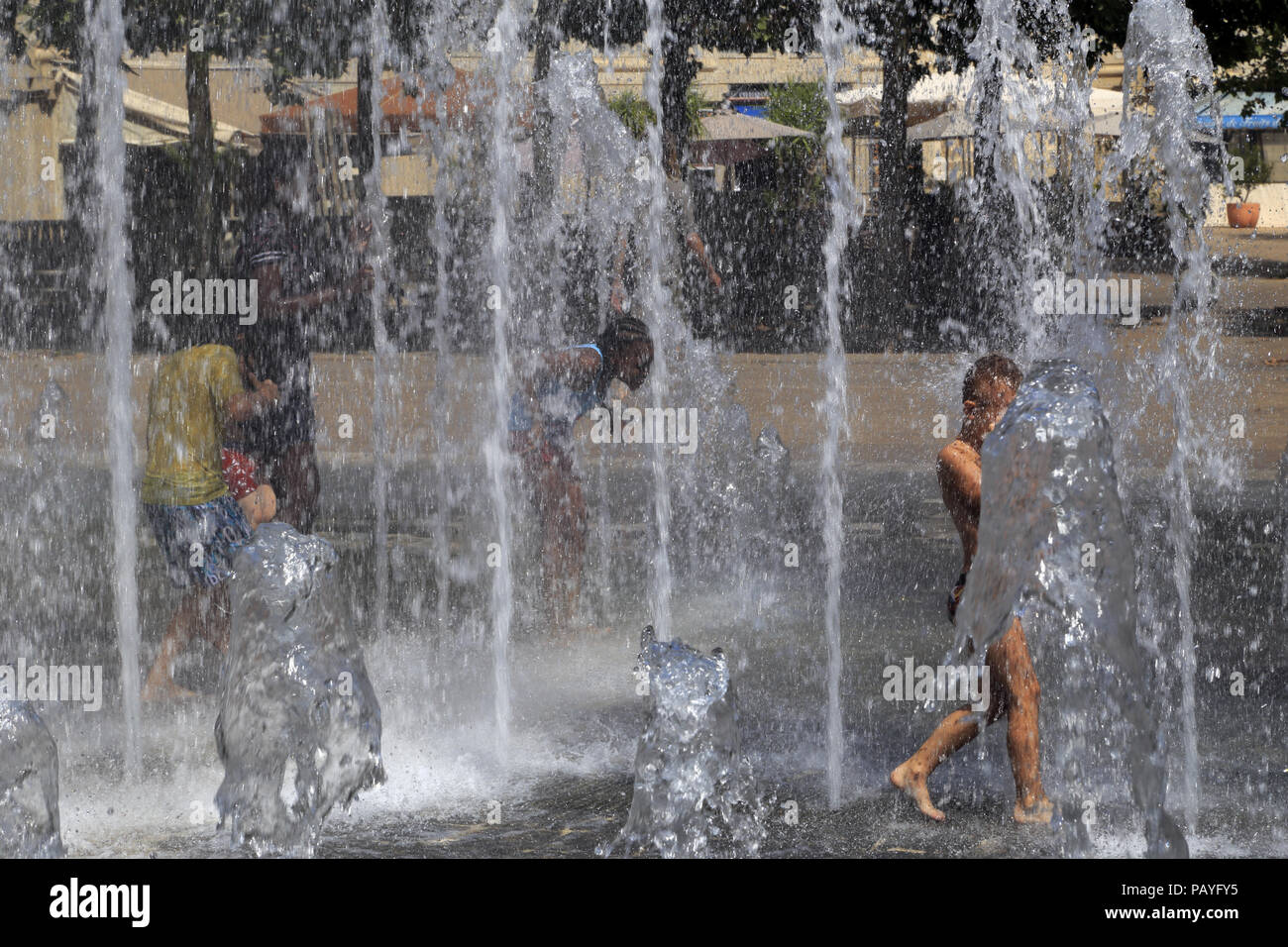 Refreshment in the Zeus Fountain, on the Place du Nombre d'Or, Antigone district. Montpellier Occitanie France. Stock Photo