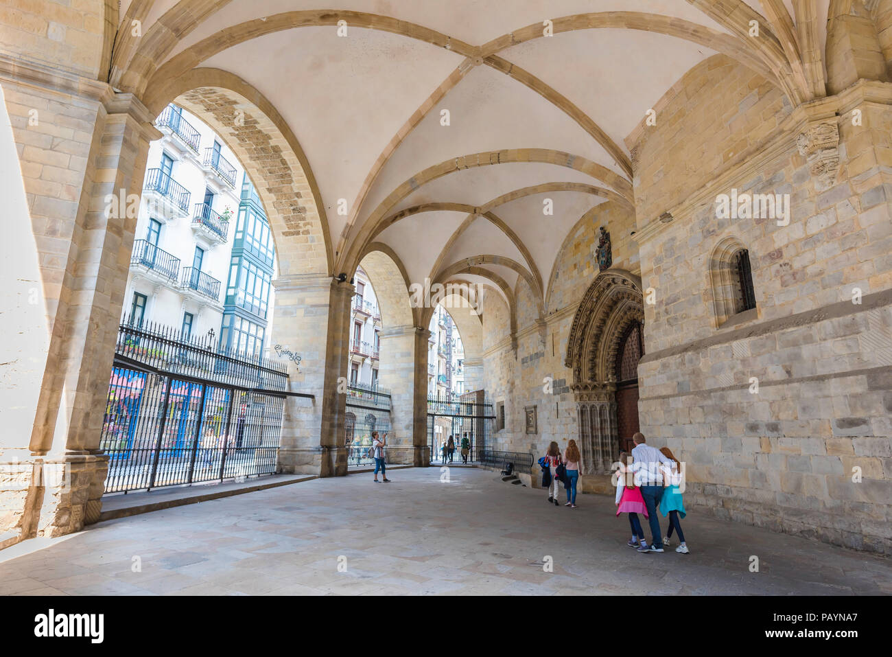 Family group Europe, a family group approach the east door of the Cathedral in Bilbao, Spain. Stock Photo