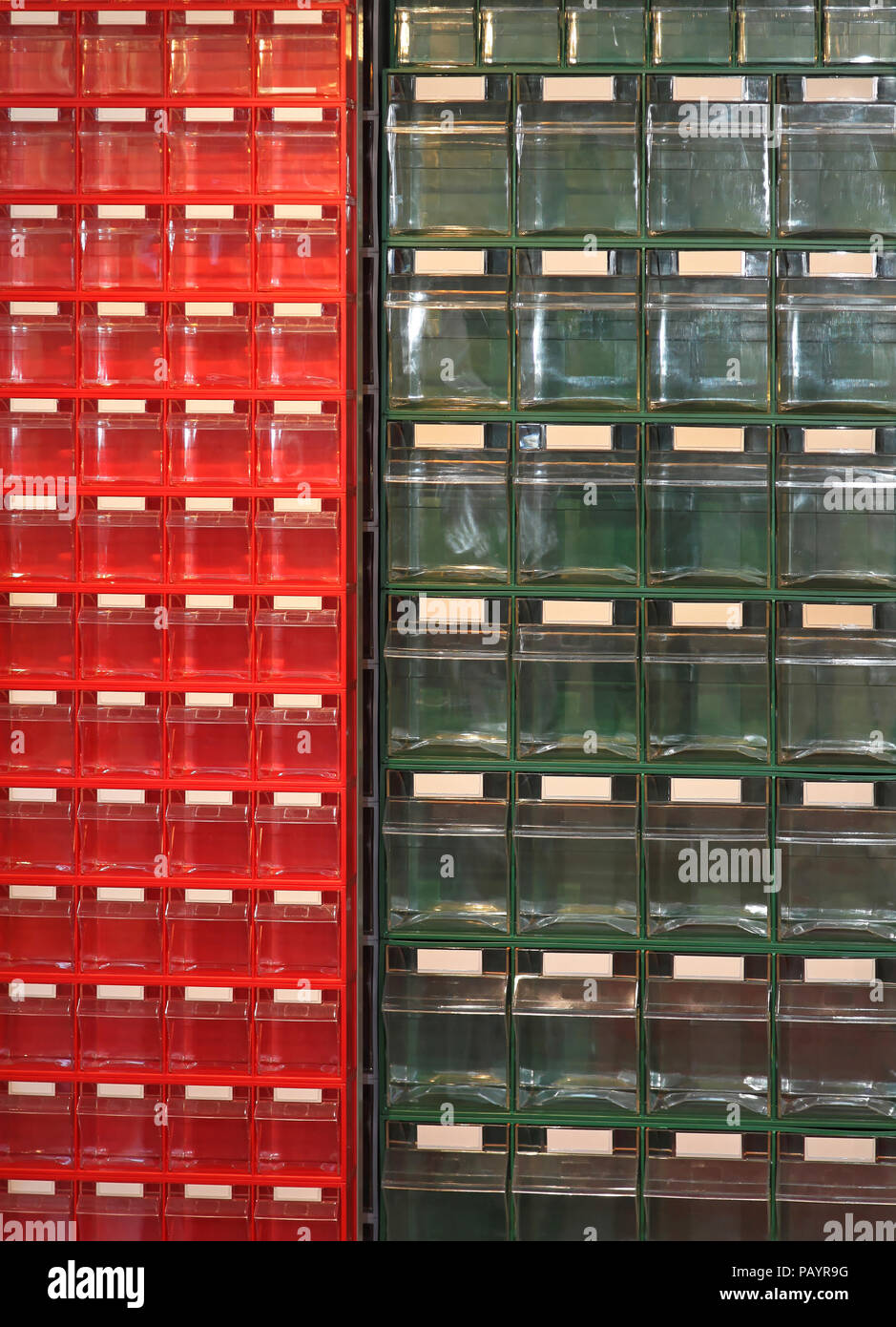 Red And Green Plastic Drawers For Small Parts Stock Photo
