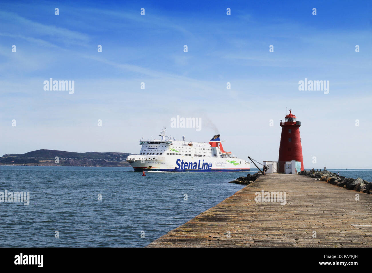 The Stena Superfast X car ferry passing Poolbeg Lighthouse,Dublin, Ireland on its way to Dublin Port with Howth Head in the background. Stock Photo