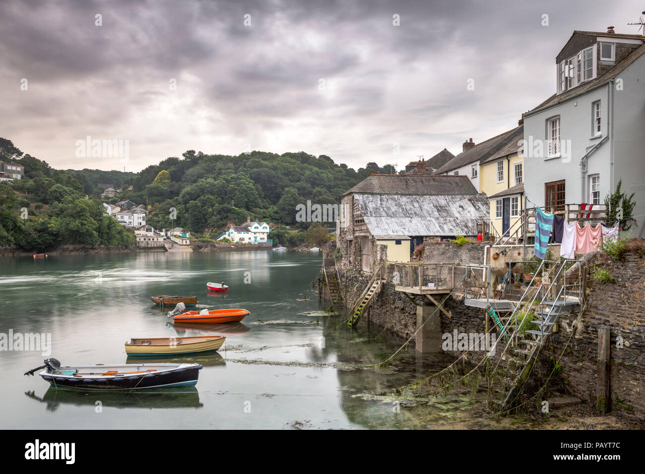 Properties back directly onto the waterfront at the picturesque little harbour at Fowey in East Cornwall made famous as the home of Daphne Du Maurier. Stock Photo