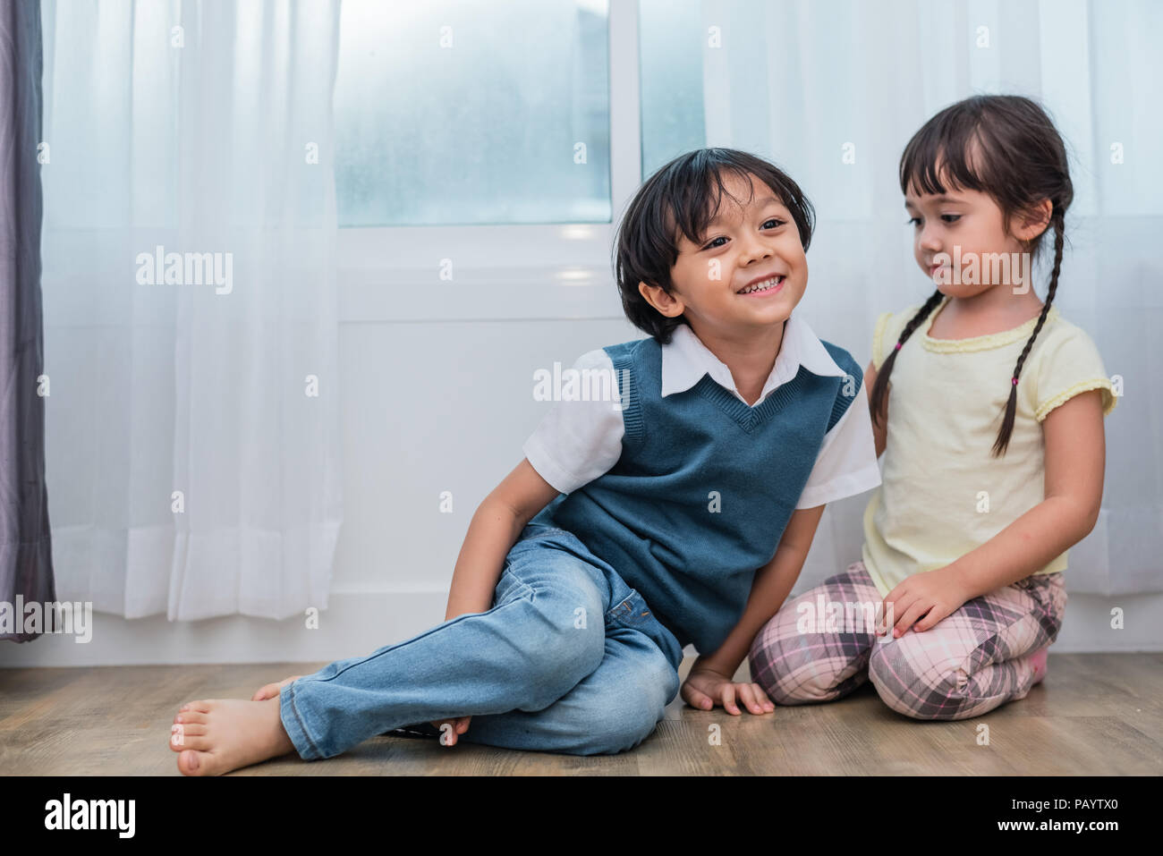 Two Caucasians brother and sister portrait. Children and kids concept. People and lifestyles concept. Happy family and sibling love theme. Stock Photo