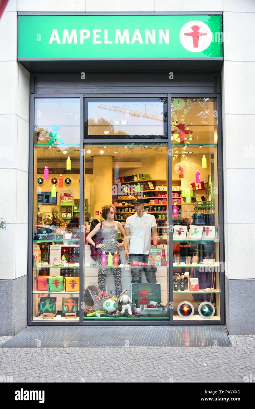 BERLIN, GERMANY - AUGUST 25, 2014: People visit Ampelmann souvenir store in Berlin. Ampelmann is the pedestrian light symbol in Berlin. It was conceiv Stock Photo