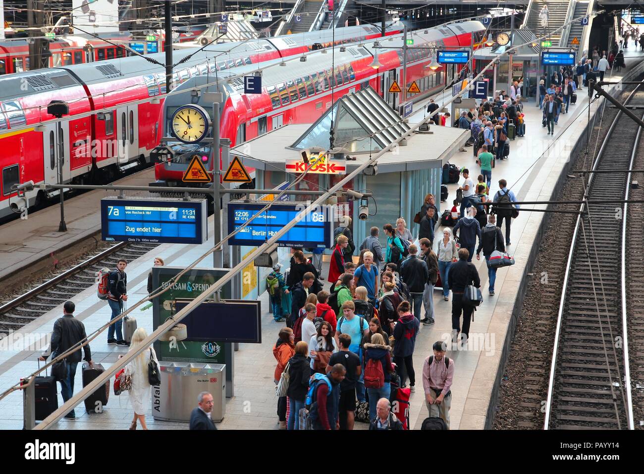 HAMBURG, GERMANY - AUGUST 28, 2014: Travelers board trains at Central Railway Station (Hauptbahnhof) in Hamburg. With 450,000 daily passengers it is t Stock Photo