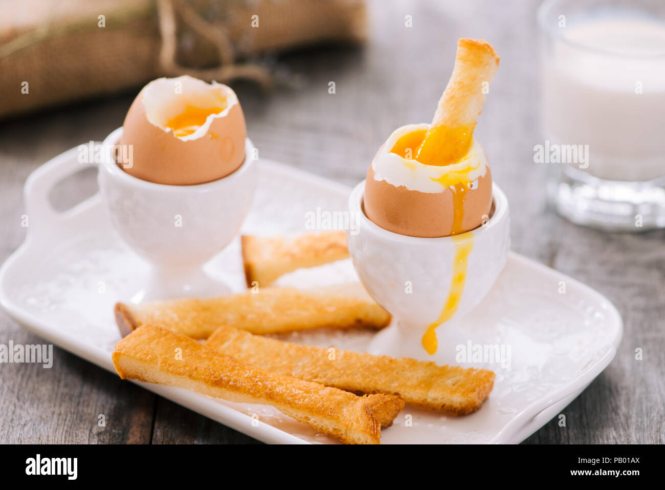 delicious breakfast with boiled eggs and crispy toasts, horizontal, closeup Stock Photo