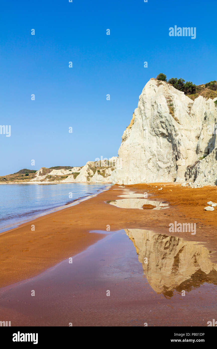 Orange sands beach with high white rocks Stock Photo - Alamy