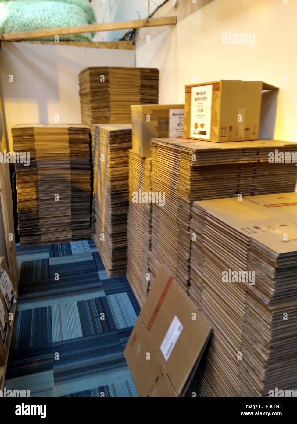 stack of cardboard packaging boxes ready for house removal, storage or