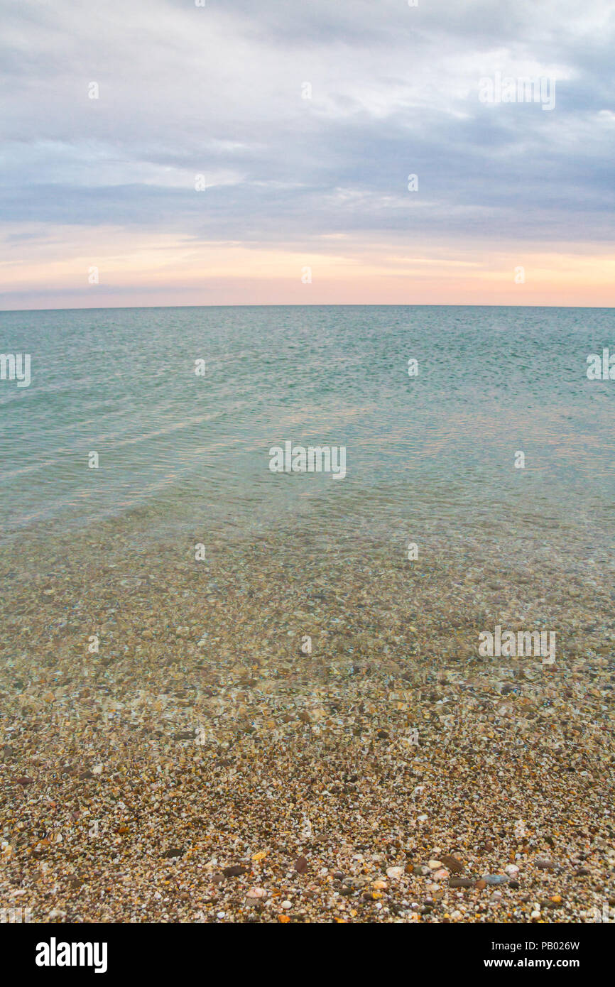 Beautiful summer sunset with clouds over the sea Stock Photo - Alamy