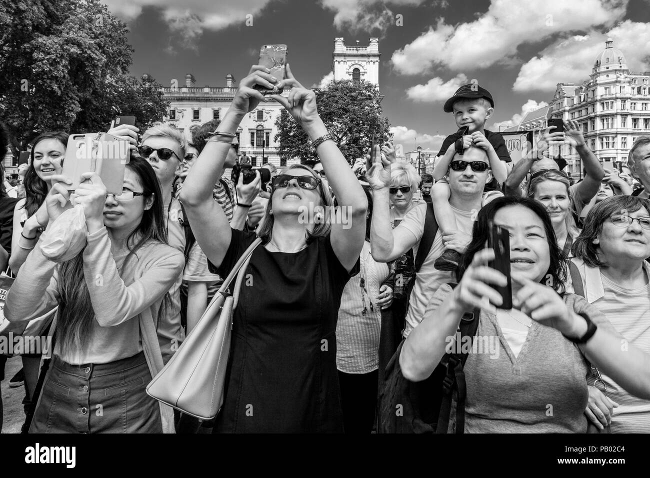 People Taking Photographs In Parliament Square, During An Anti Trump Protest, London, England Stock Photo