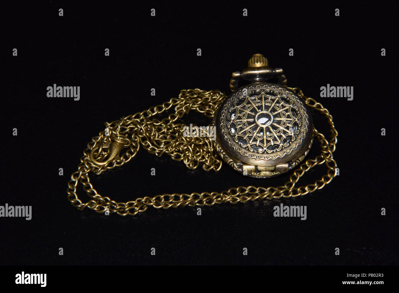 Ornamented Vintage Pocket Watch on Black Background Isolated Metal