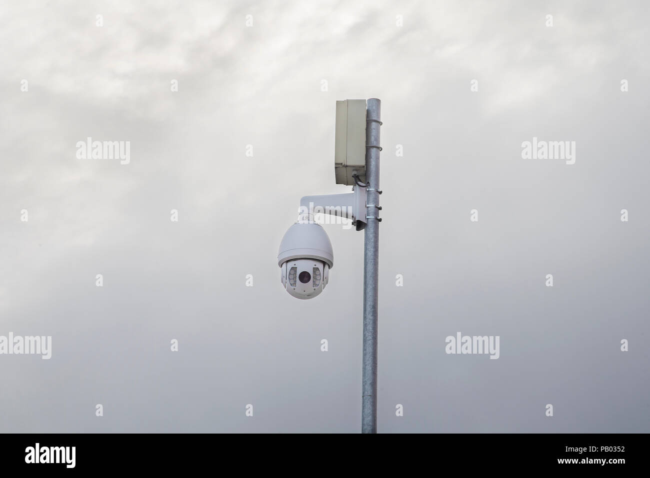 Security camera in the town on the post Stock Photo - Alamy