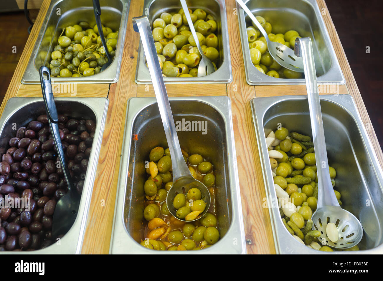Olive bar in a Spanish delicatessen, UK Stock Photo Alamy