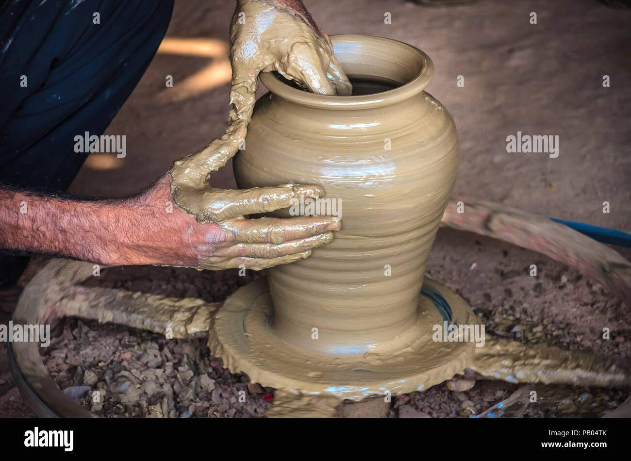 Closeup of potter's hands making clay water pot on pottery wheel. Clay pots  are used since ancient times and can be found in Indian subcontinent Stock  Photo - Alamy