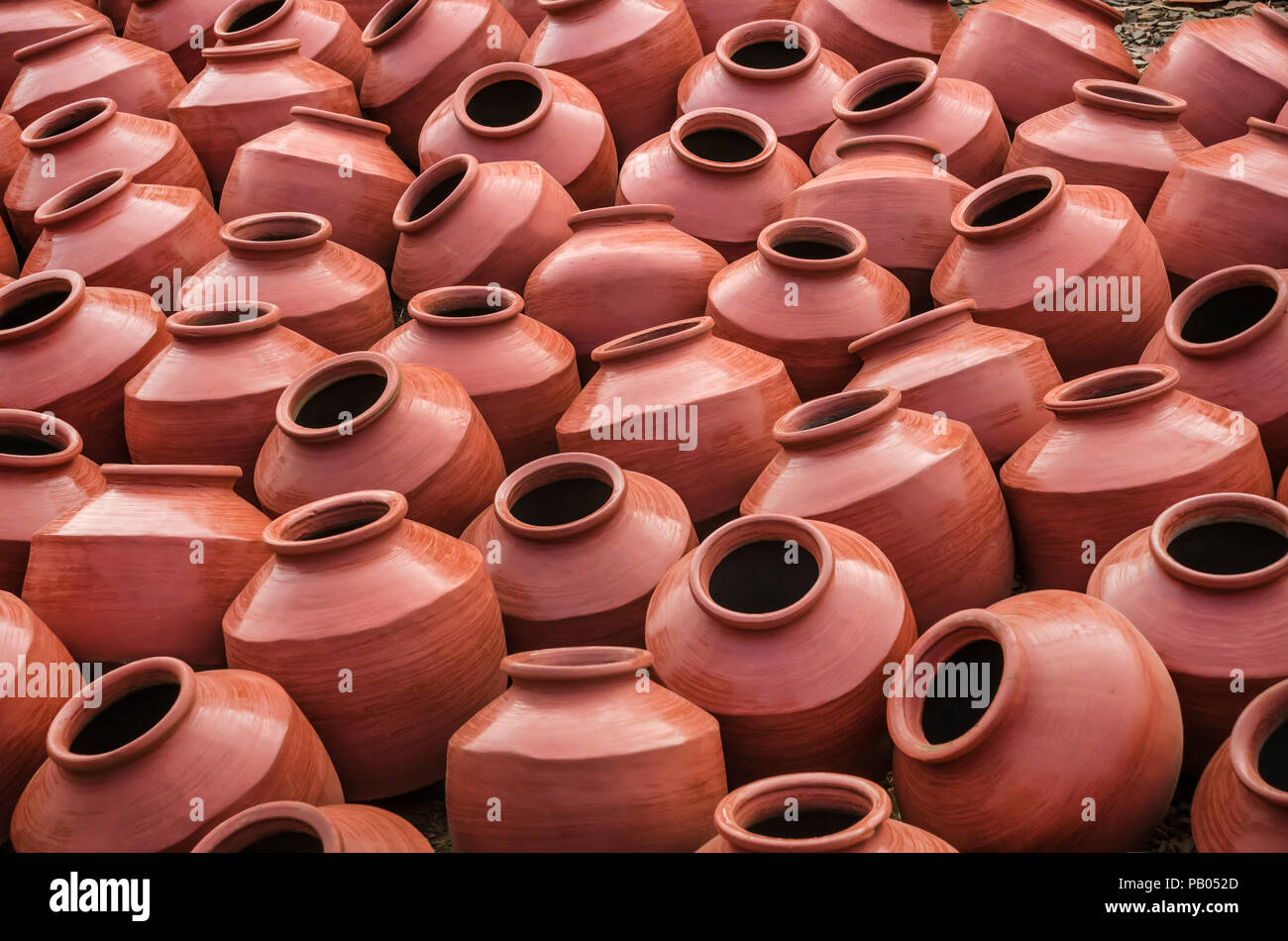 Collection of terracotta clay pots made from mud also known as Matka. Clay pots are used since ancient times and can be found in Indian subcontinent. Stock Photo