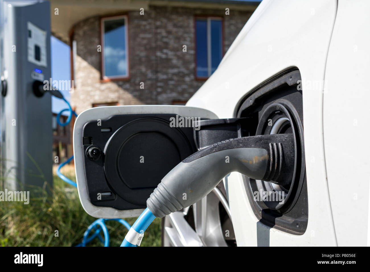 electric car being charged Stock Photo