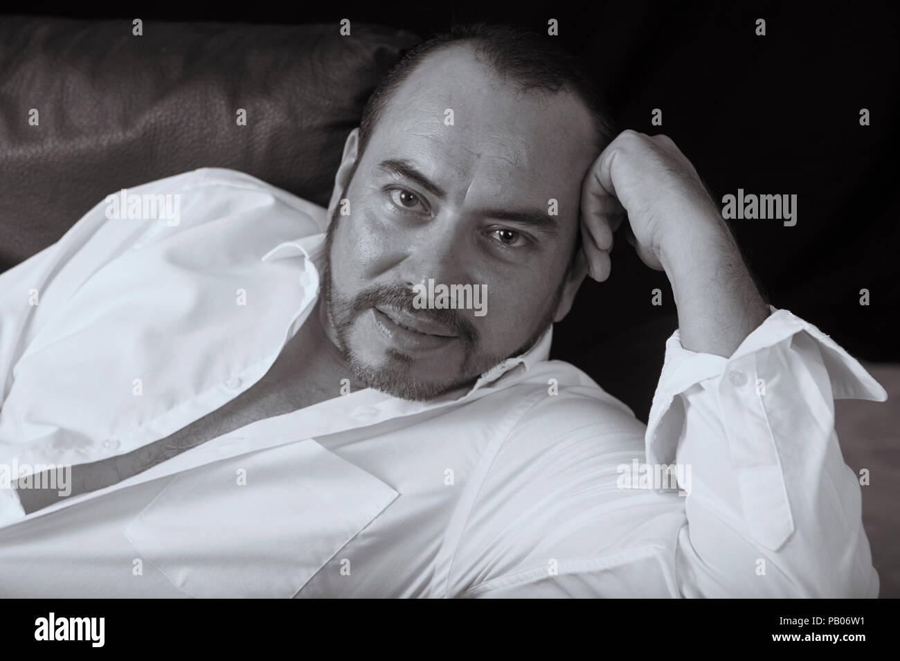 Black and White studio portrait of a man in white shirt Stock Photo - Alamy