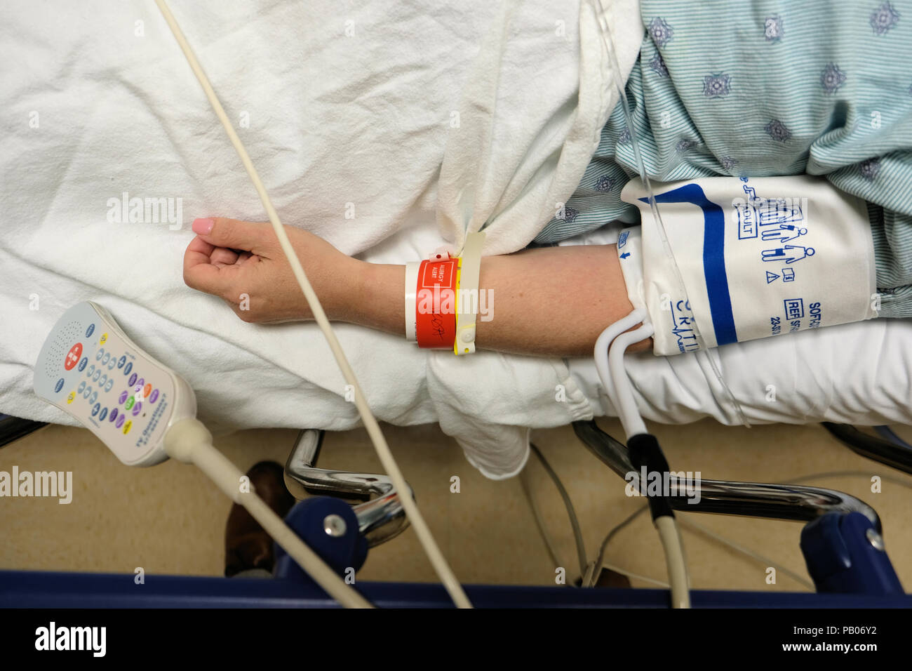 Blood pressure cuff on a hospitalized female patient after surgery