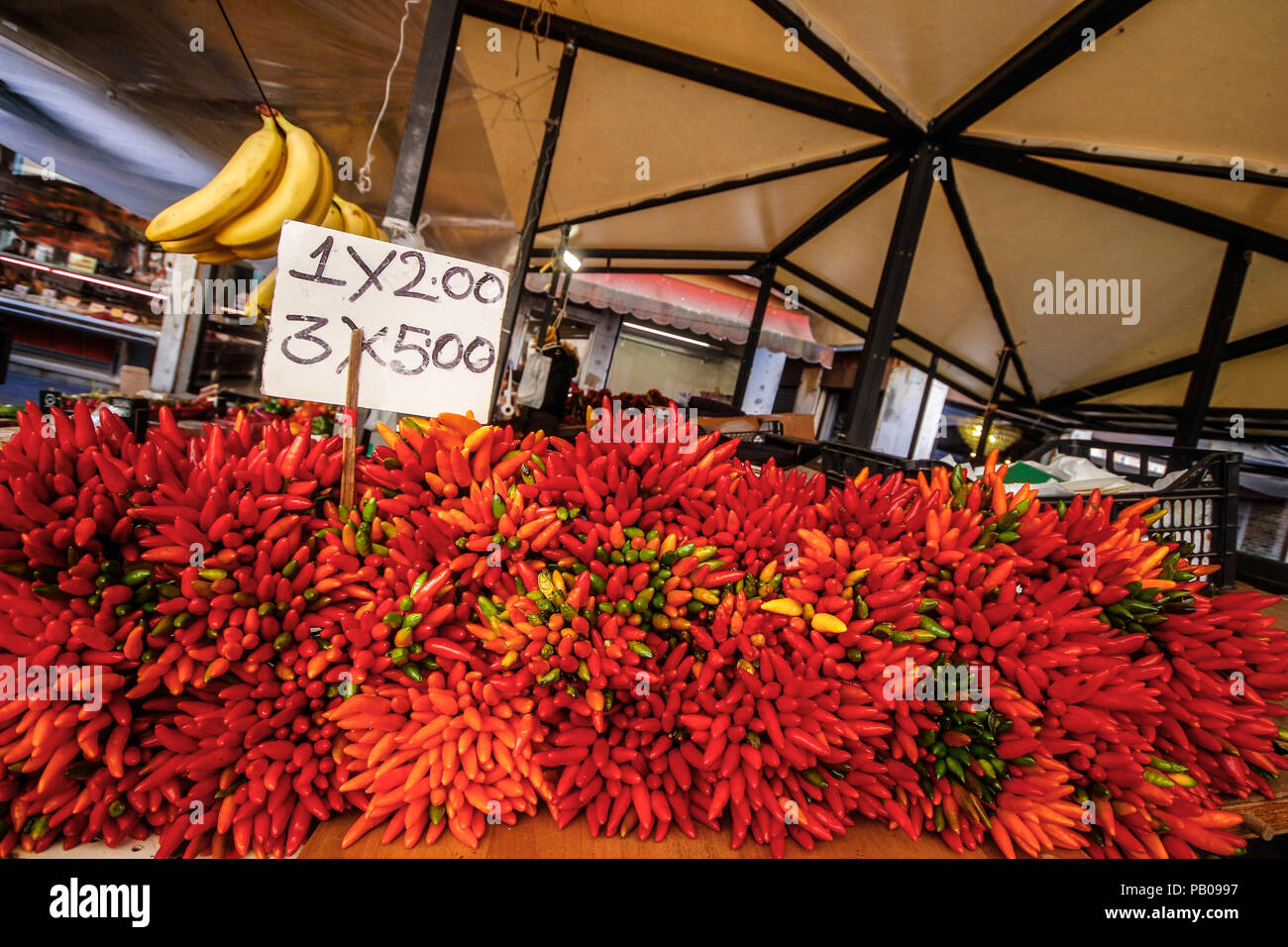 Chili peppers on a market stall Stock Photo - Alamy
