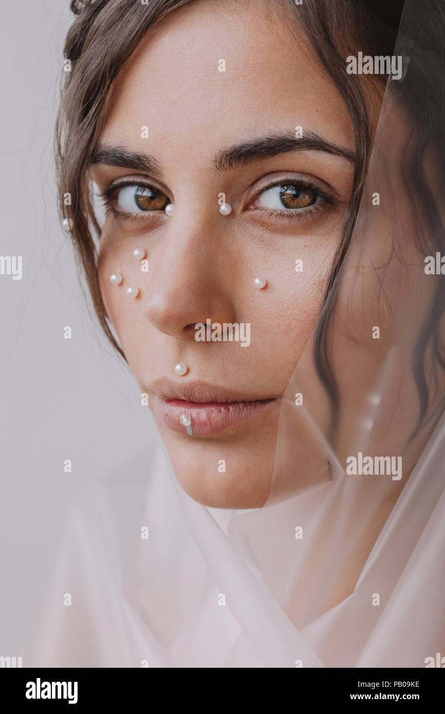 Portrait of a woman with pearls on her face Stock Photo