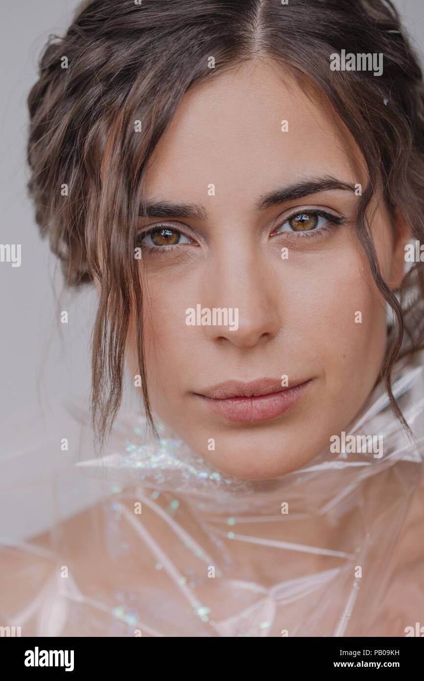 Portrait of a woman wrapped in plastic Stock Photo