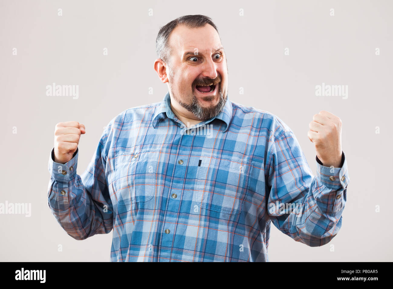 Portrait of ecstatic man Stock Photo